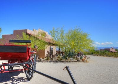 Wagon in front of Dude Ranch Tack Building