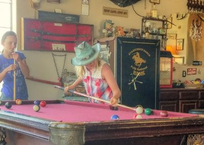 Guests playing billiards in Lodge