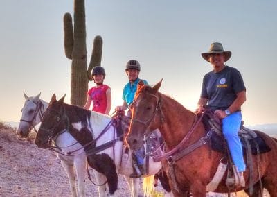 Guests riding near Saguaro cactus