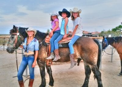 Three Girls riding horse