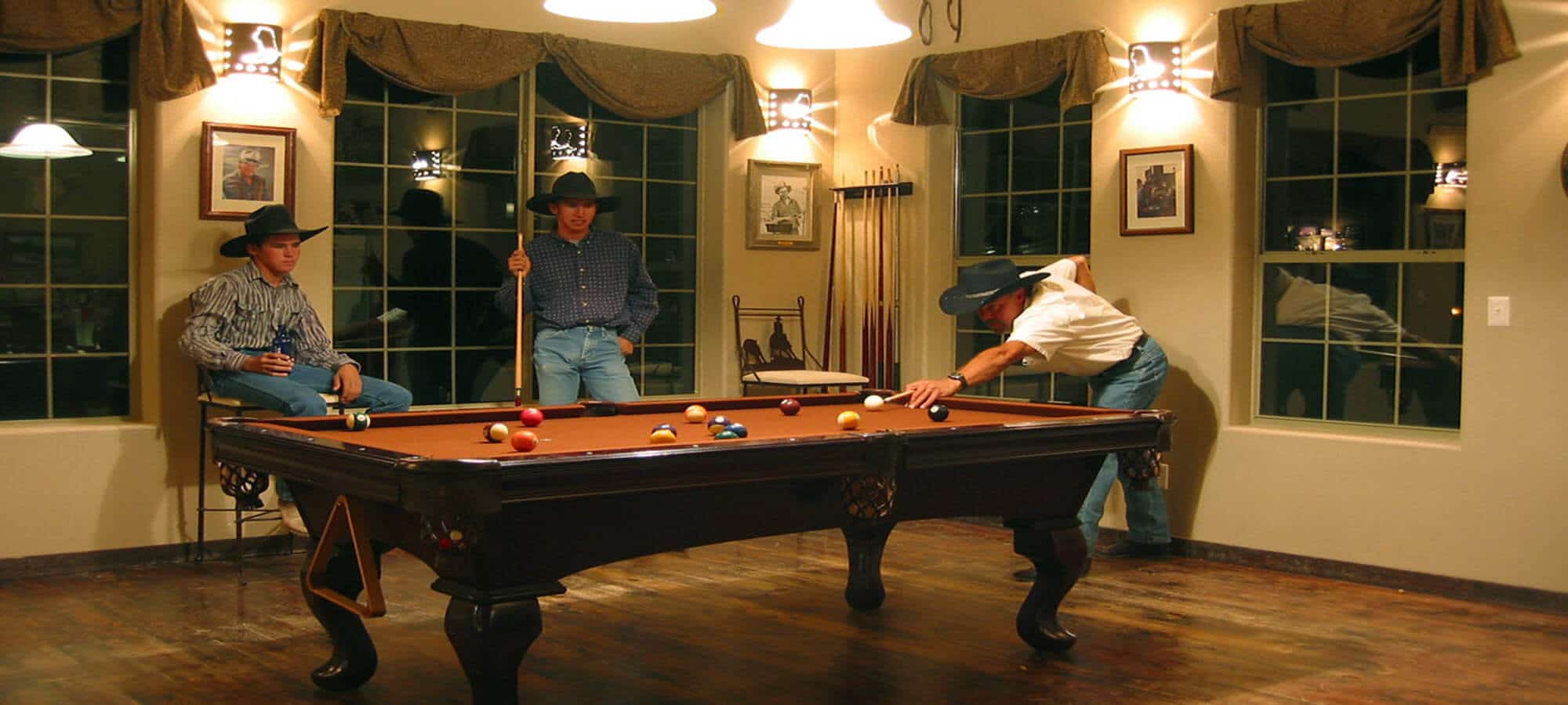 Cowboys playing billiards